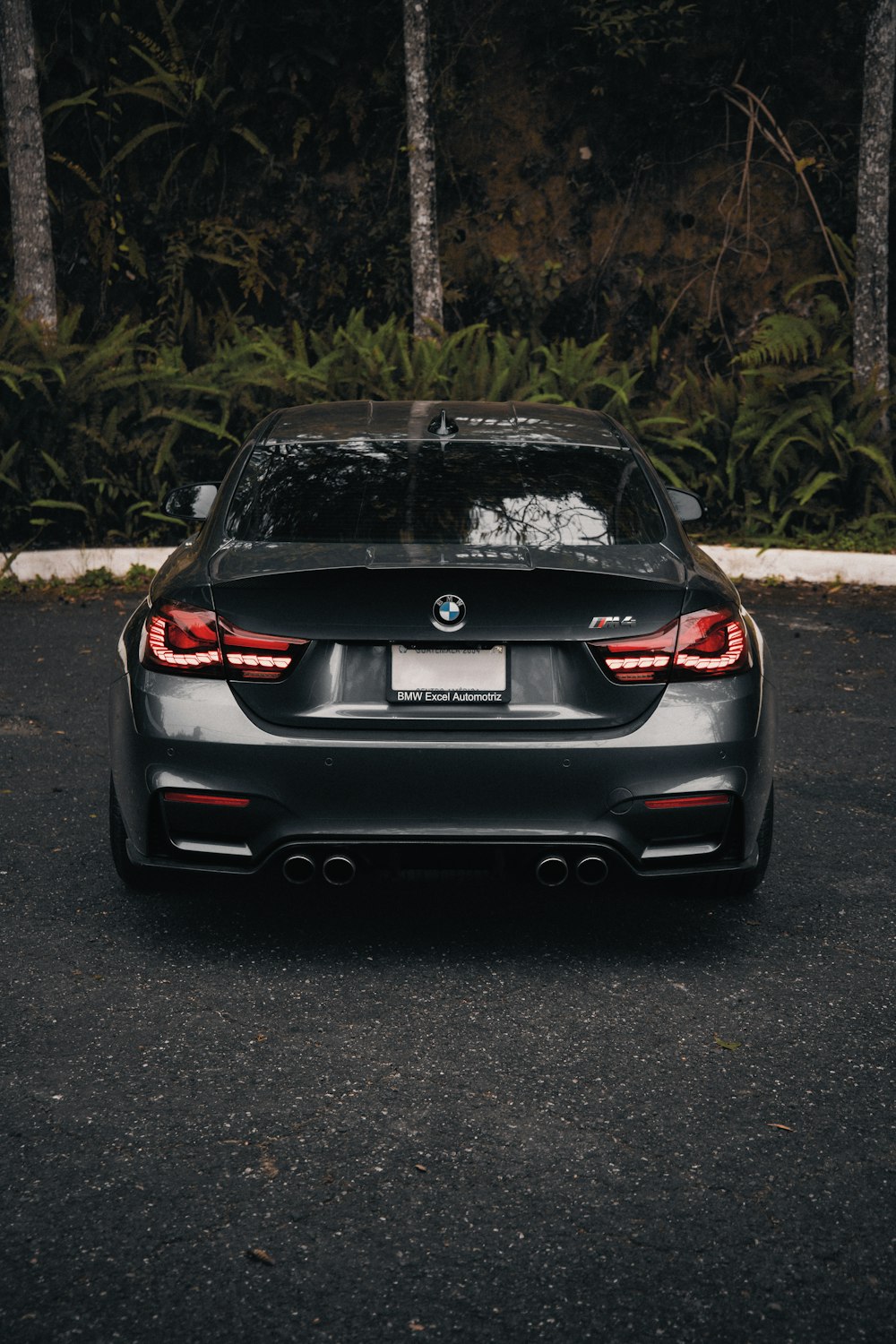 a black car parked in a parking lot