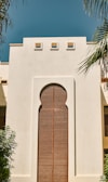 a large white building with a wooden door