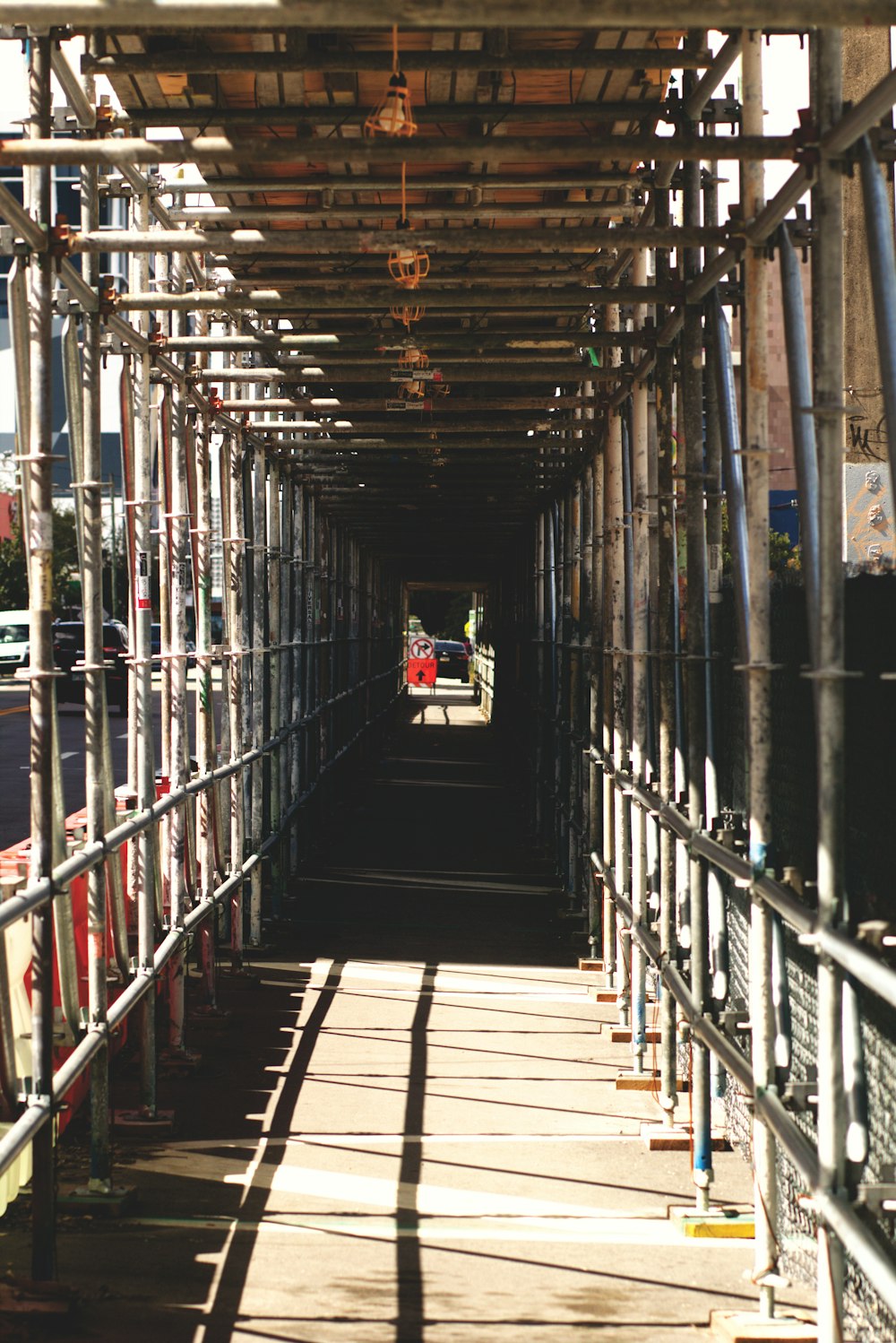 a view of a long hallway with pipes and pipes