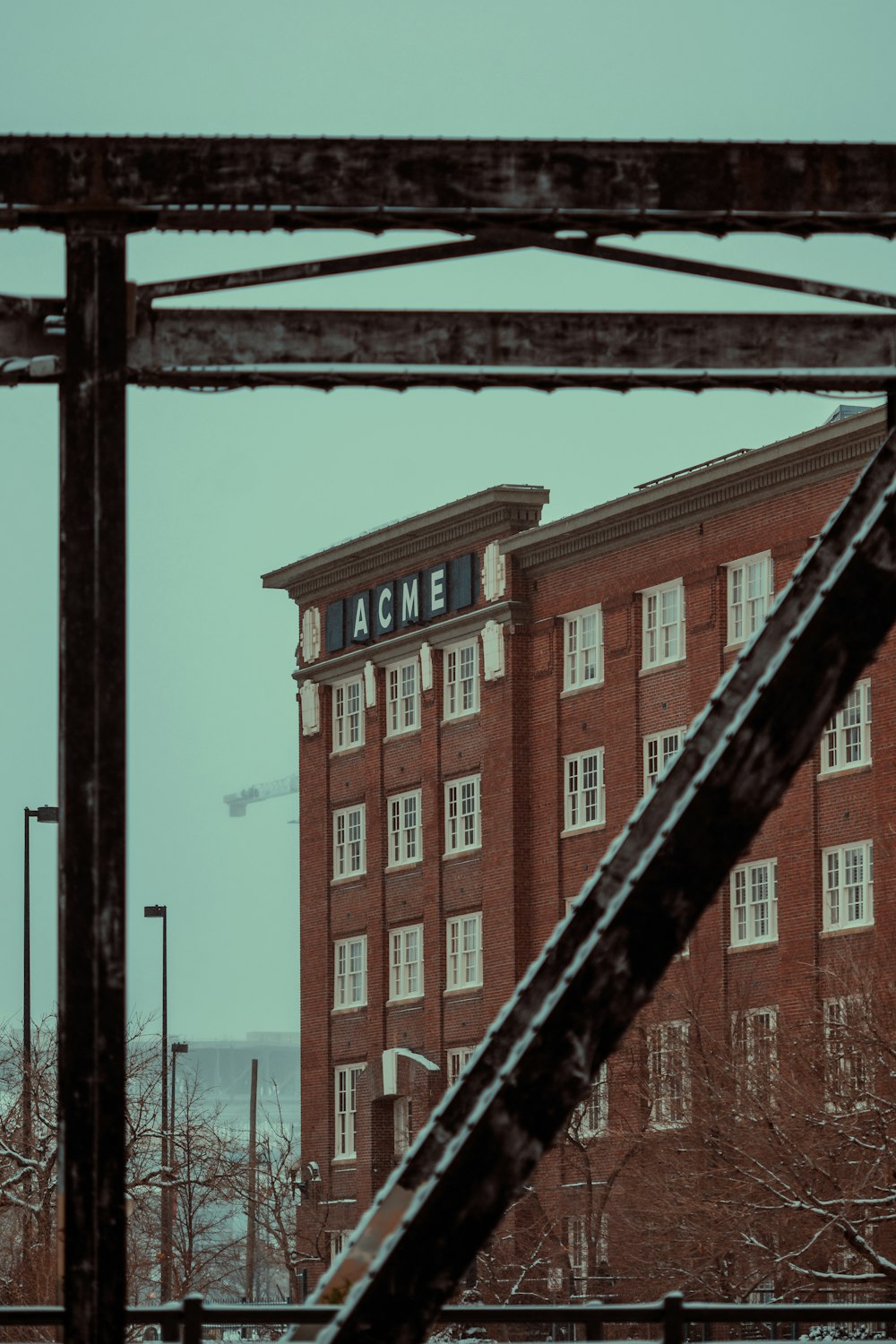 a large red brick building with a clock on top