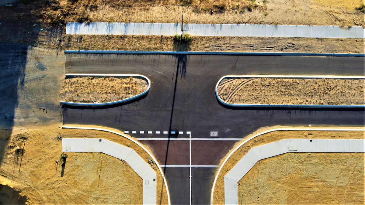 Aerial view of a curving road through open land