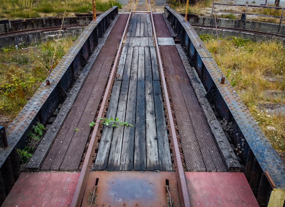 a train bridge with a train on it's tracks