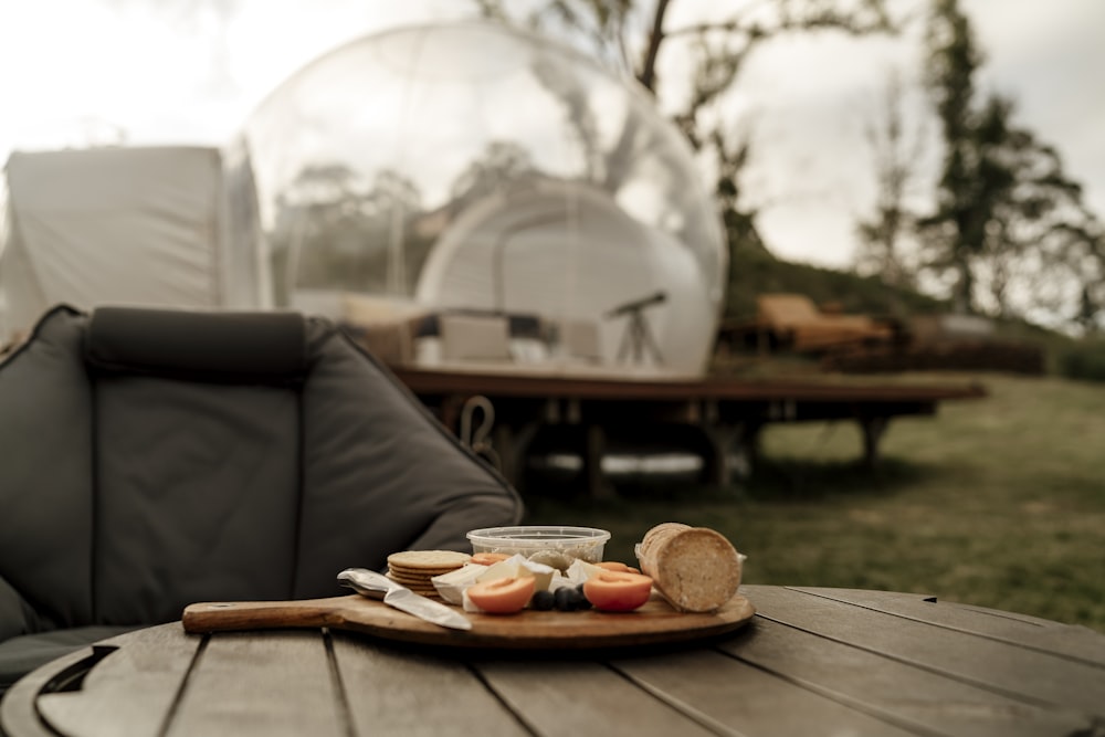 a plate of food sitting on top of a wooden table