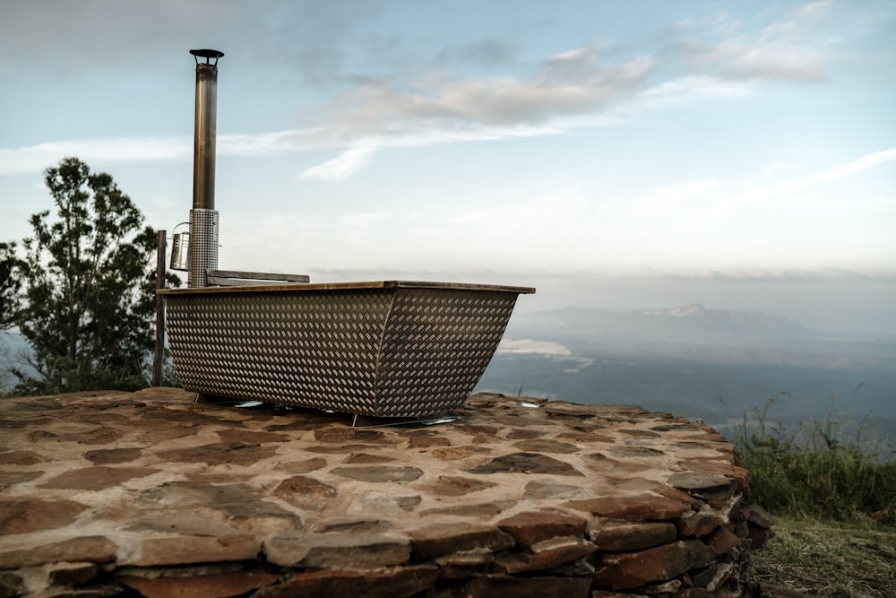 a basket sitting on top of a stone slab