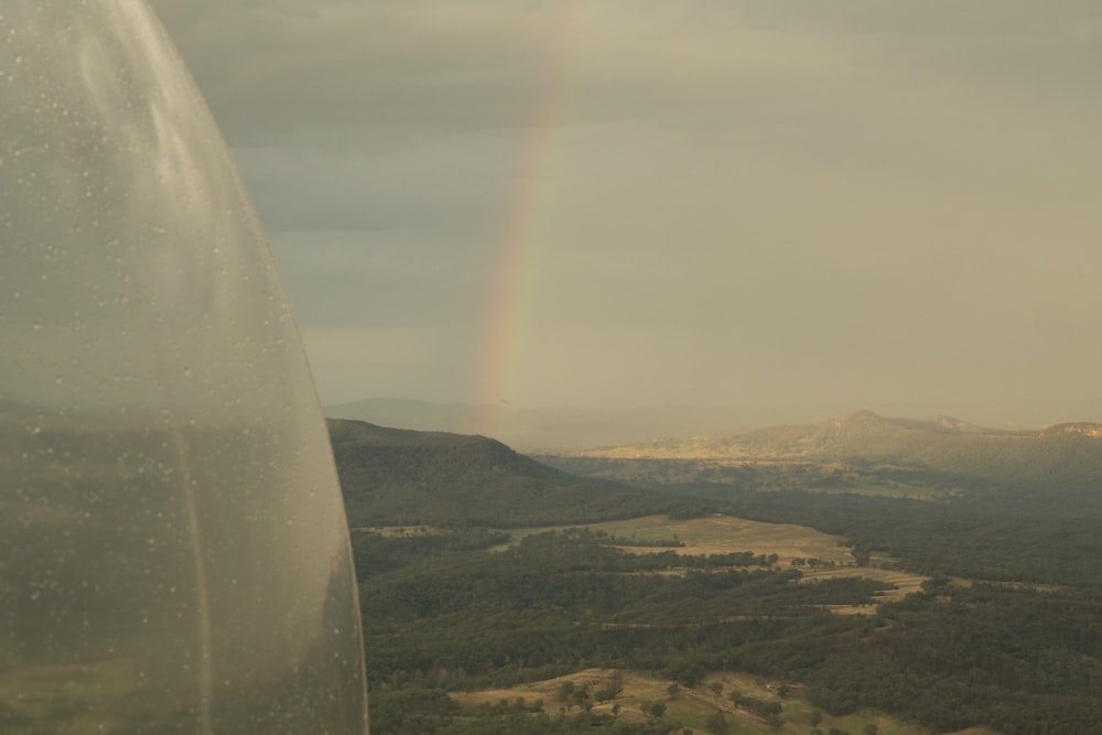 a view of a rainbow from a plane window