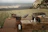 Cozy outdoor braai area with mountain backdrop at dusk.