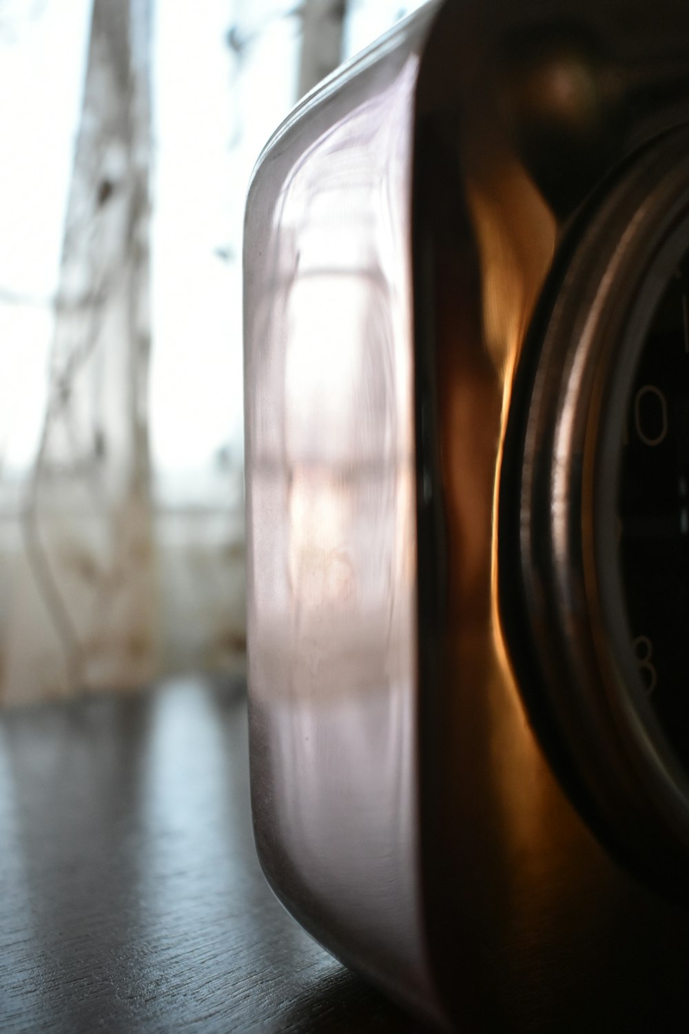 a close up of a clock on a table