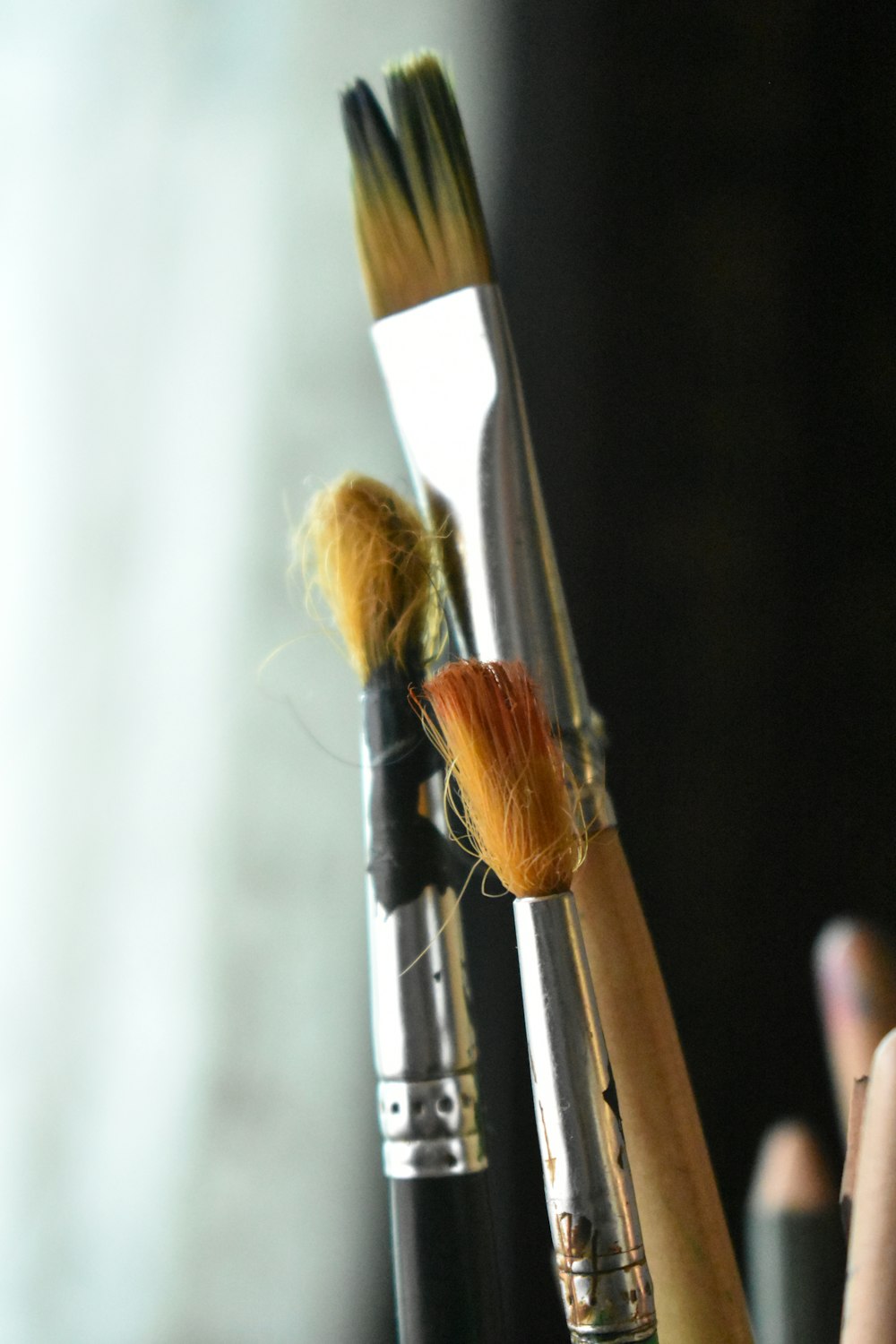 a close up of a brush and a brush holder