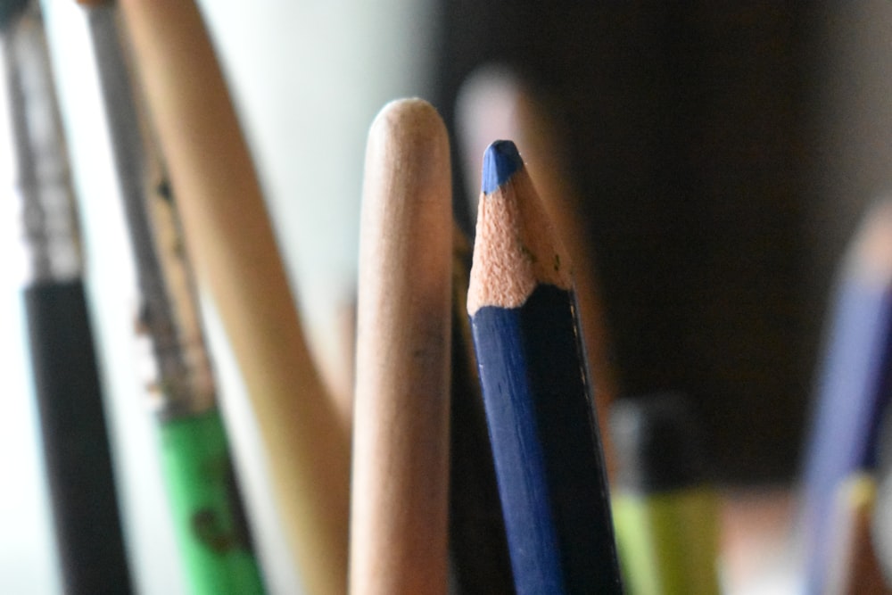 a group of pencils sitting next to each other
