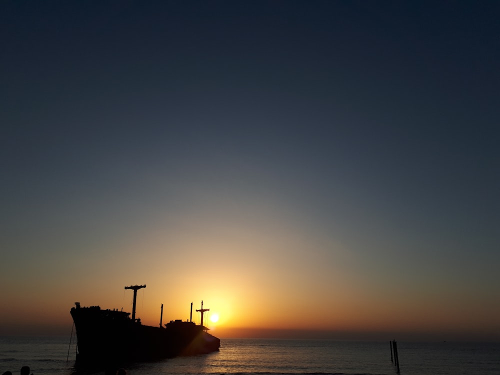 a large boat sitting on top of a body of water