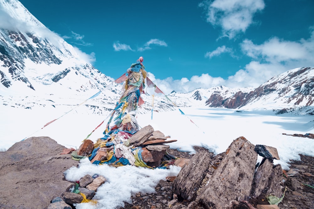 a pile of trash sitting on top of a snow covered mountain