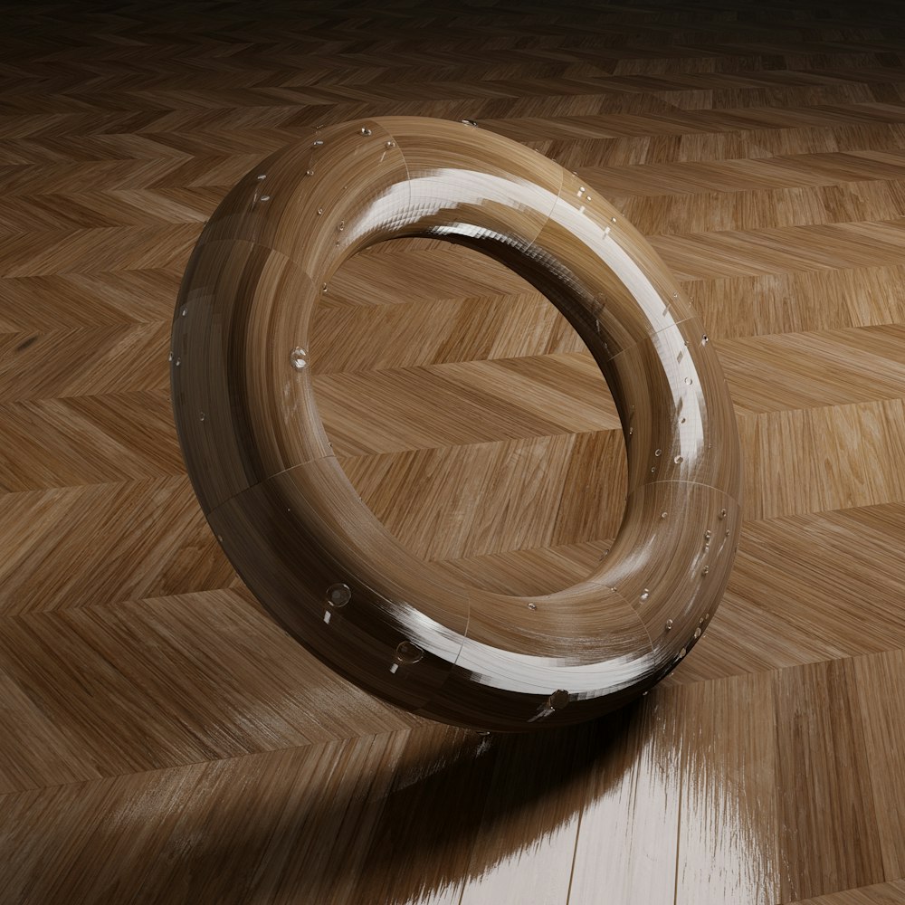 a wooden floor with a circular object on top of it