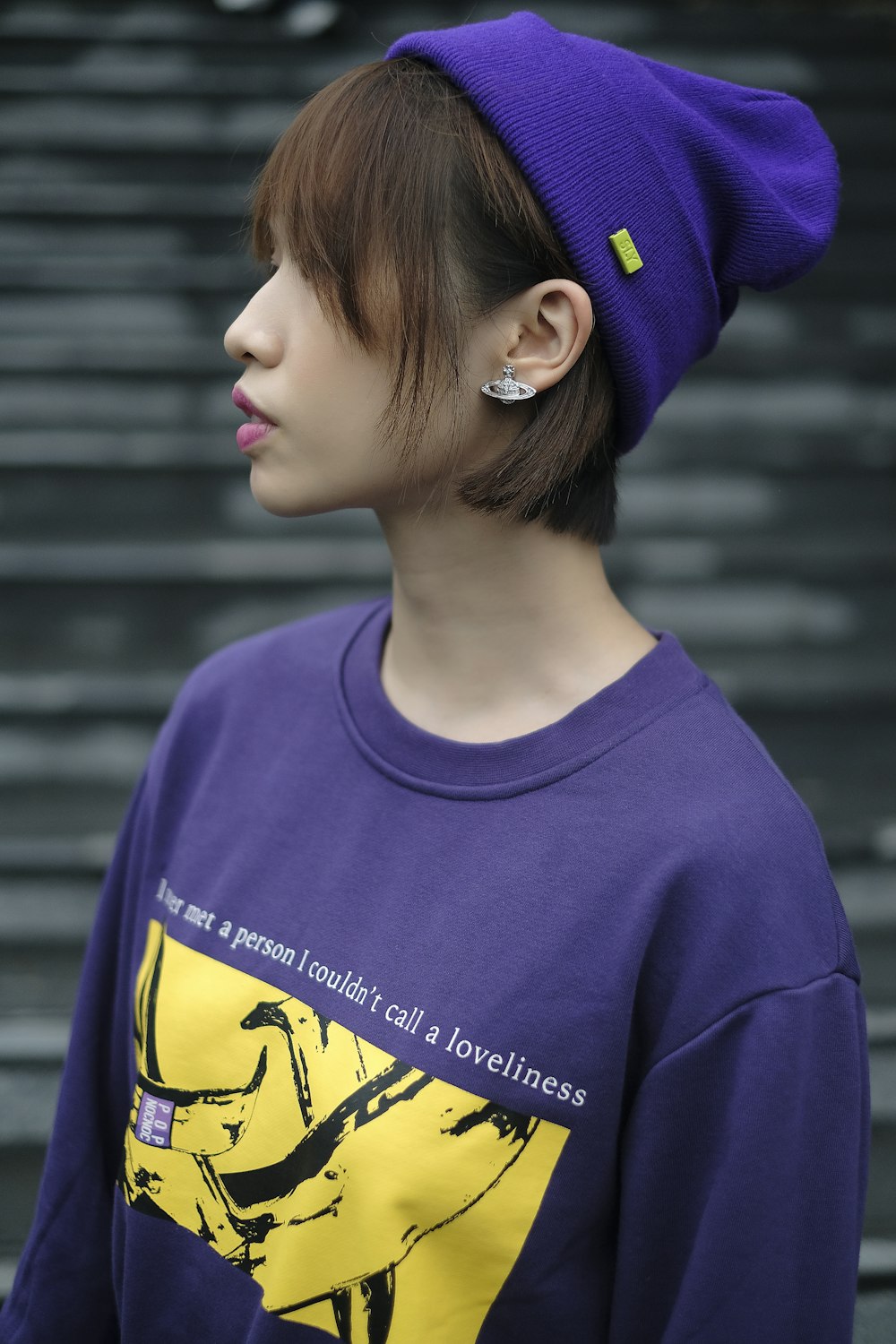 a person wearing a purple hat and a purple shirt
