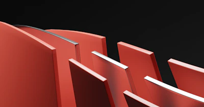 Abstract geometric shapes in dark gray and gold tones layered over a blurred car dashboard.