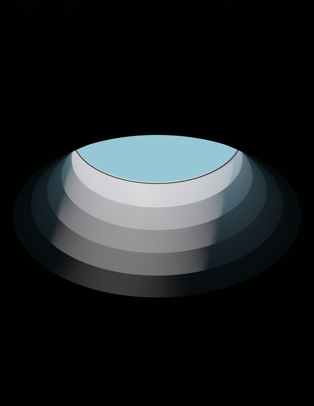 a round object with a blue center on a black background