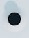 a black hole in the middle of a white wall