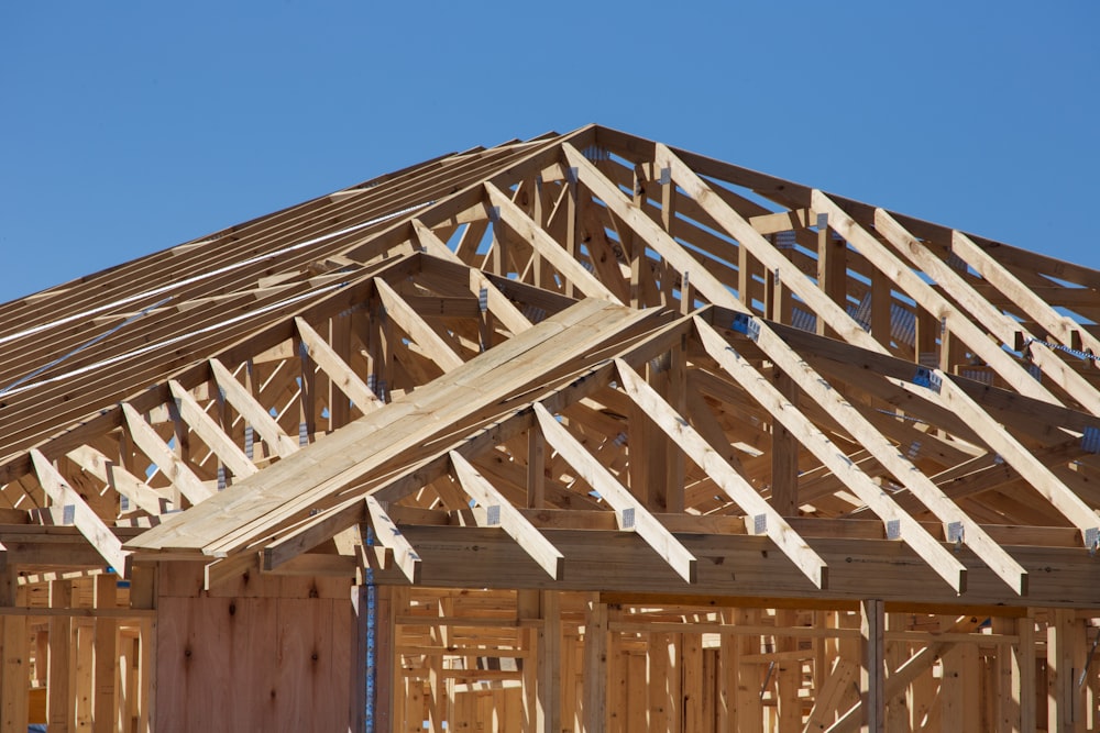 a house under construction with wooden framing