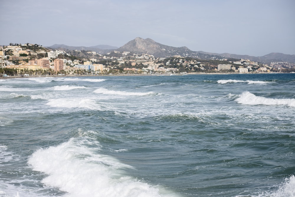 a person riding a surfboard on a wave in the ocean