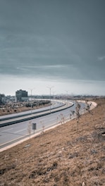 a highway with a few cars driving on it