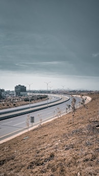 a highway with a few cars driving on it