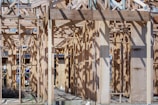 a house being built with wooden framing
