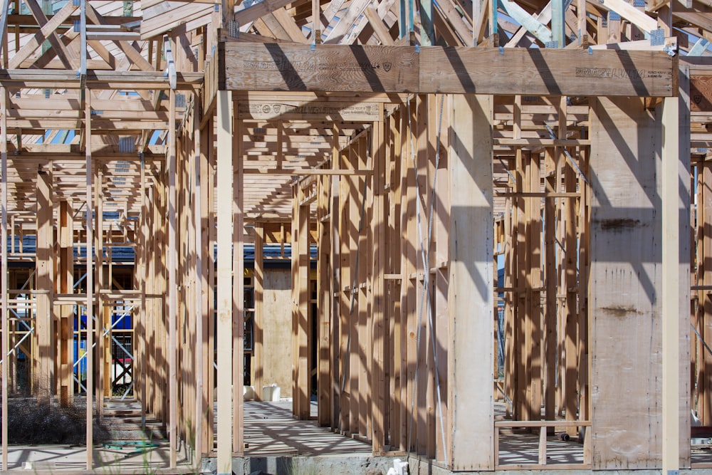 a house being built with wooden framing