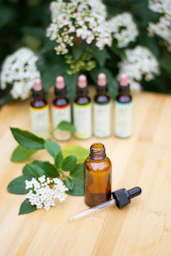 Bach flowers with bottles of essential oils