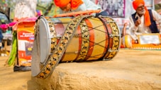 a drum sitting on top of a wooden table
