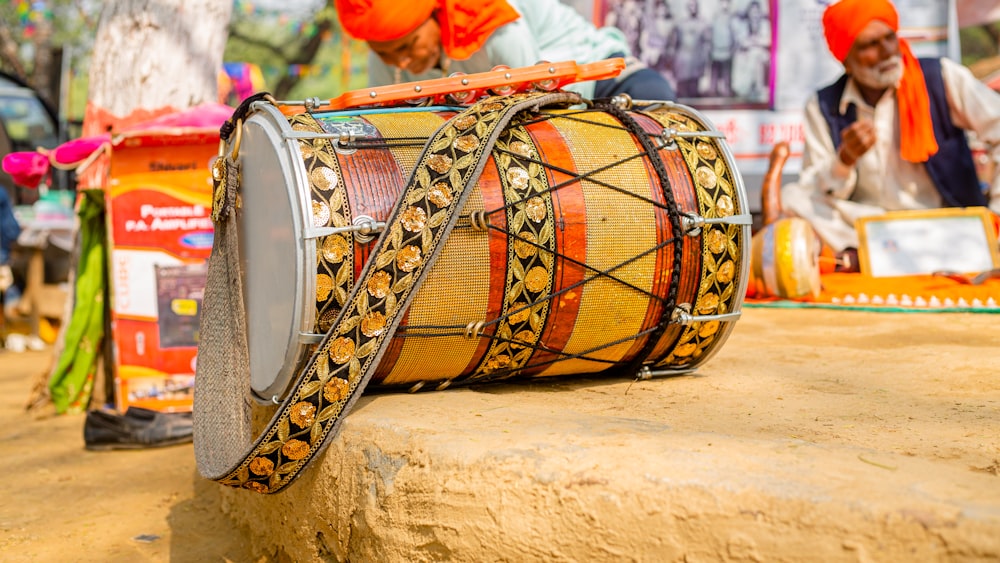 a drum sitting on top of a wooden table