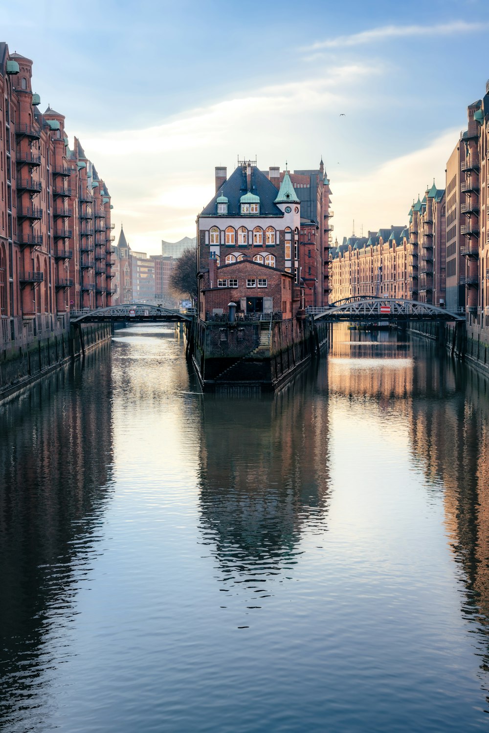 a river running through a city next to tall buildings