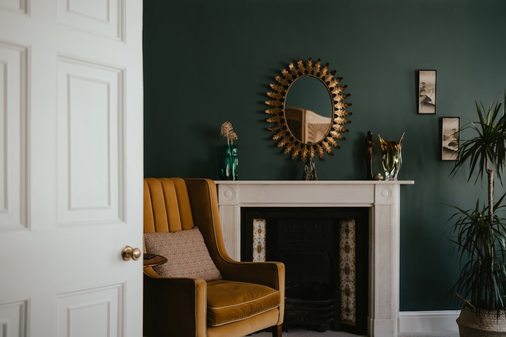 a living room with a fireplace and a mirror