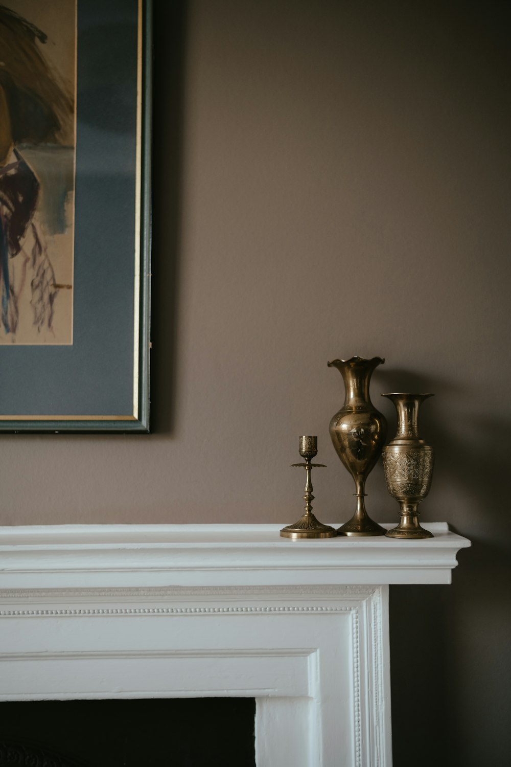 a picture of a painting on a wall above a fireplace