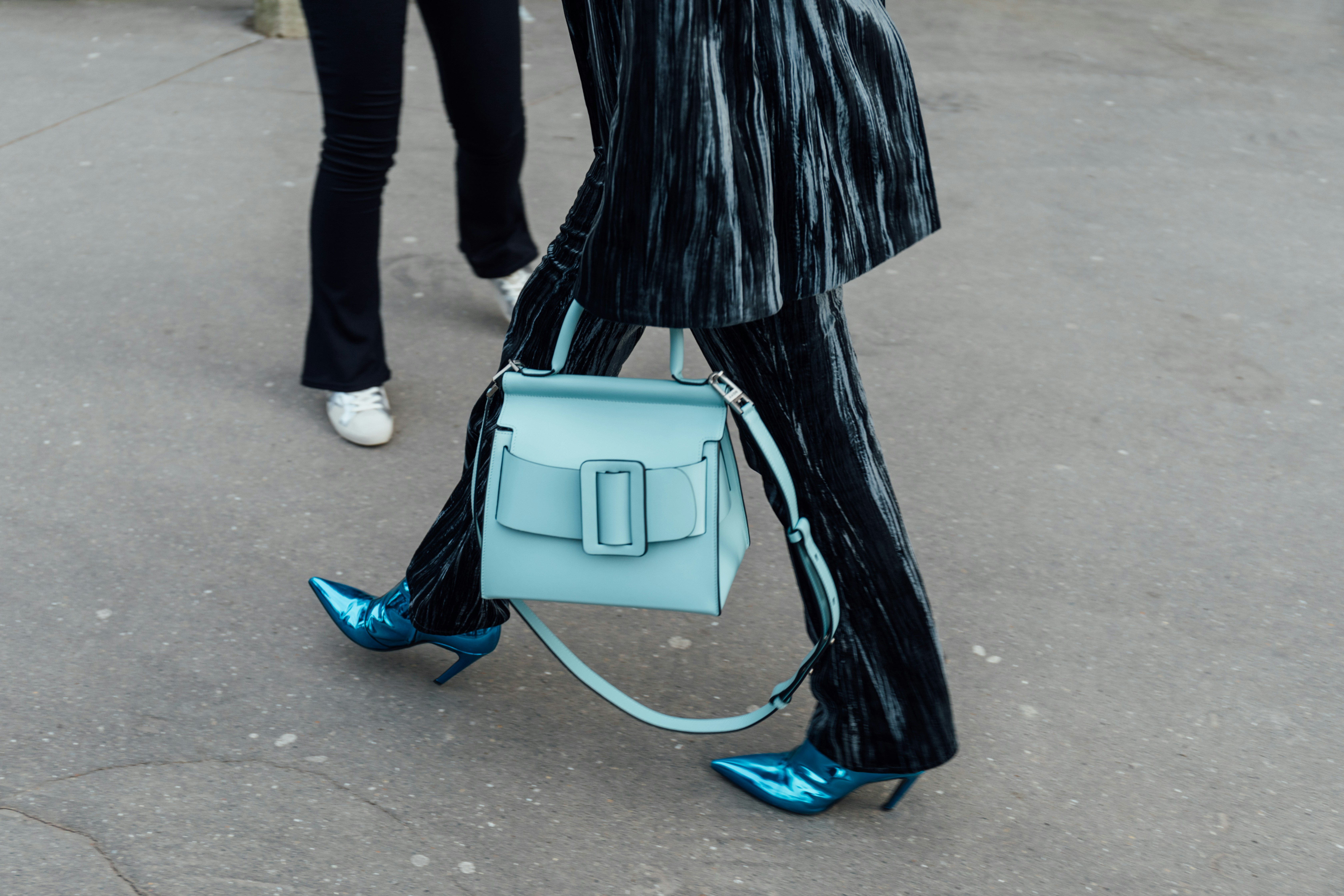 Woman with light blue bag