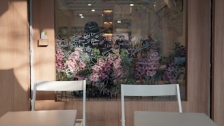 An Adelaide cafe's front window freshly cleaned, showing vibrant street life.