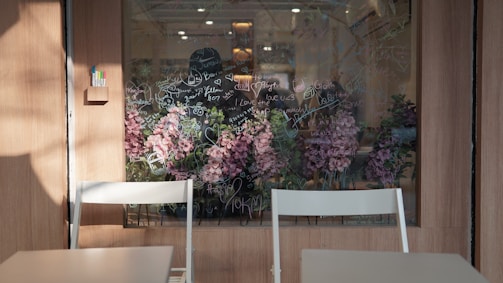 An Adelaide cafe's front window freshly cleaned, showing vibrant street life.
