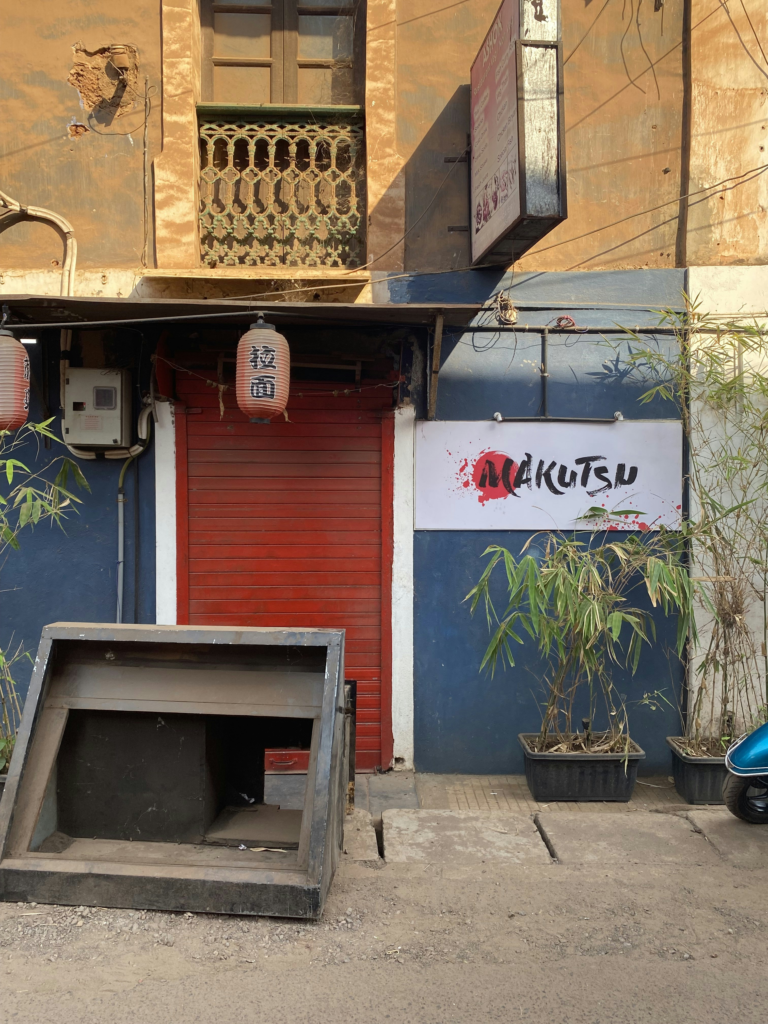 a red and blue building with a red door