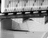 Modern architectural render featuring layered transparent geometric effects and smooth motion.