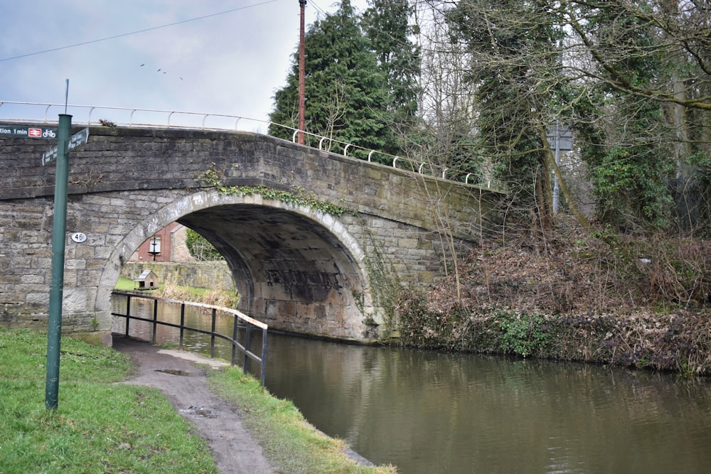 a stone bridge over a small river