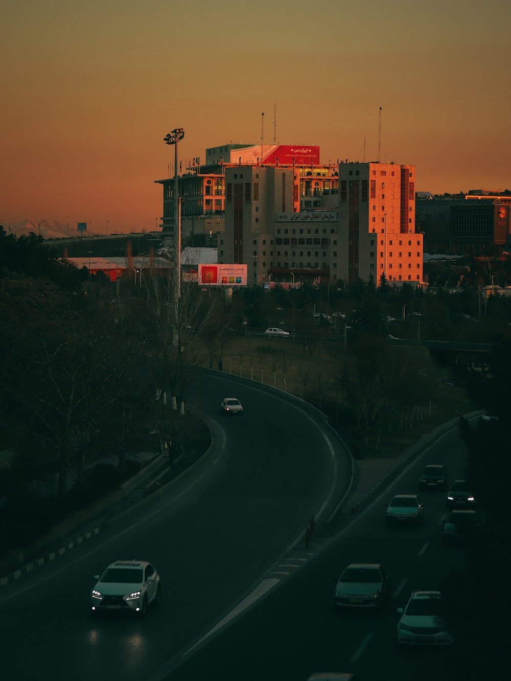 a city street with cars driving on it