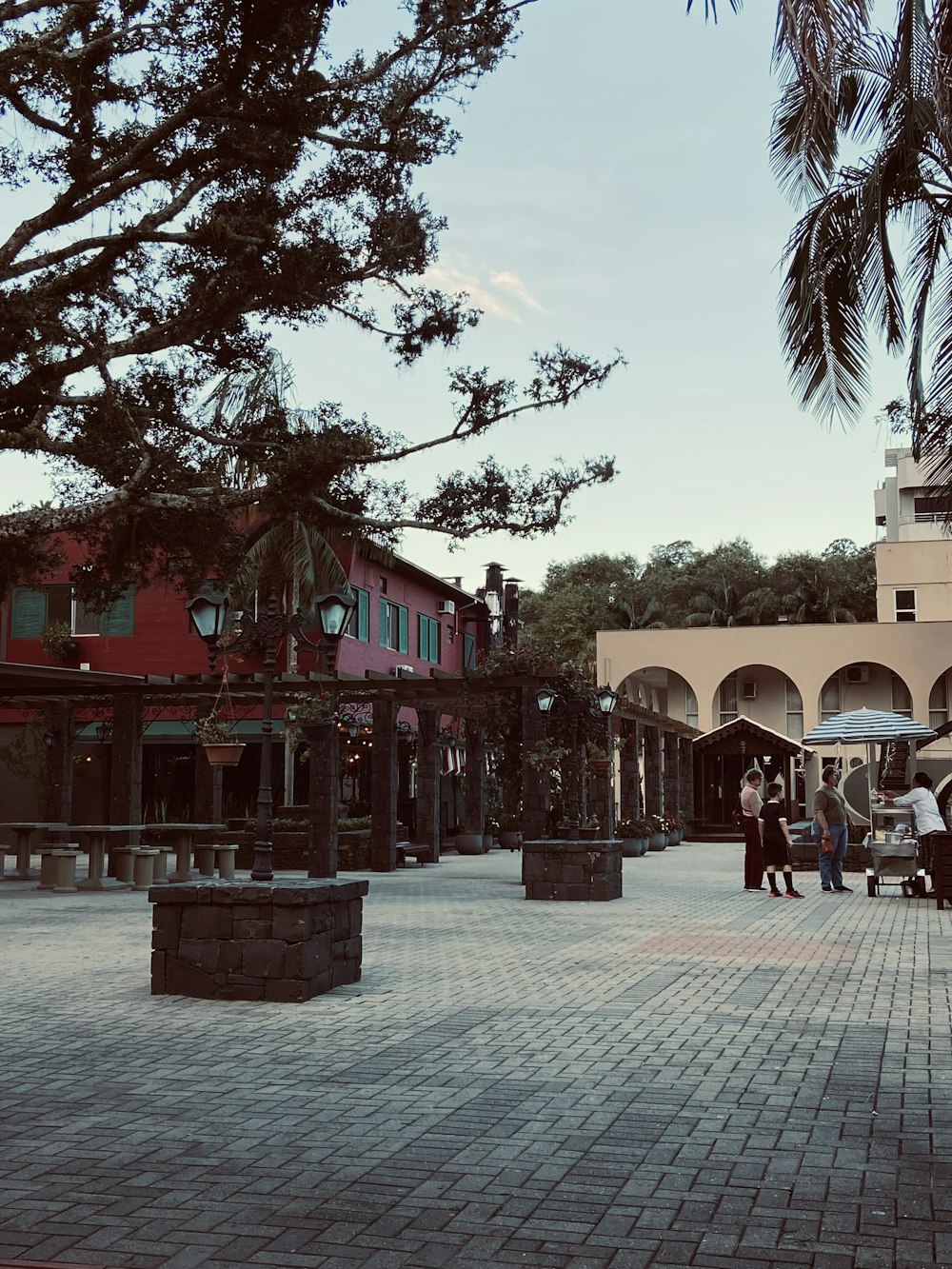 a group of people standing around a courtyard