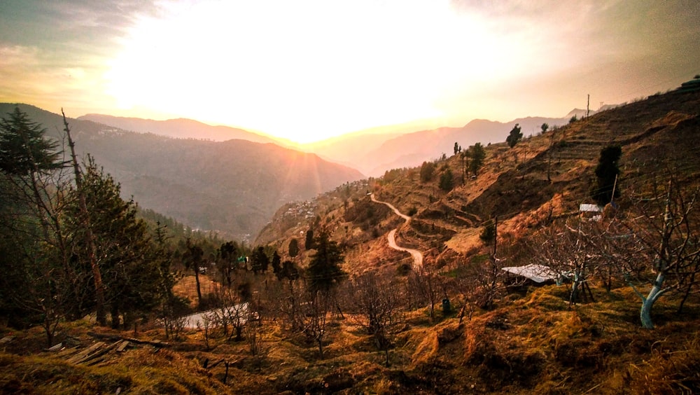 a scenic view of a mountain with a winding road