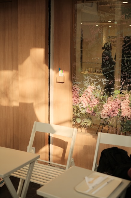 a white chair sitting next to a white table