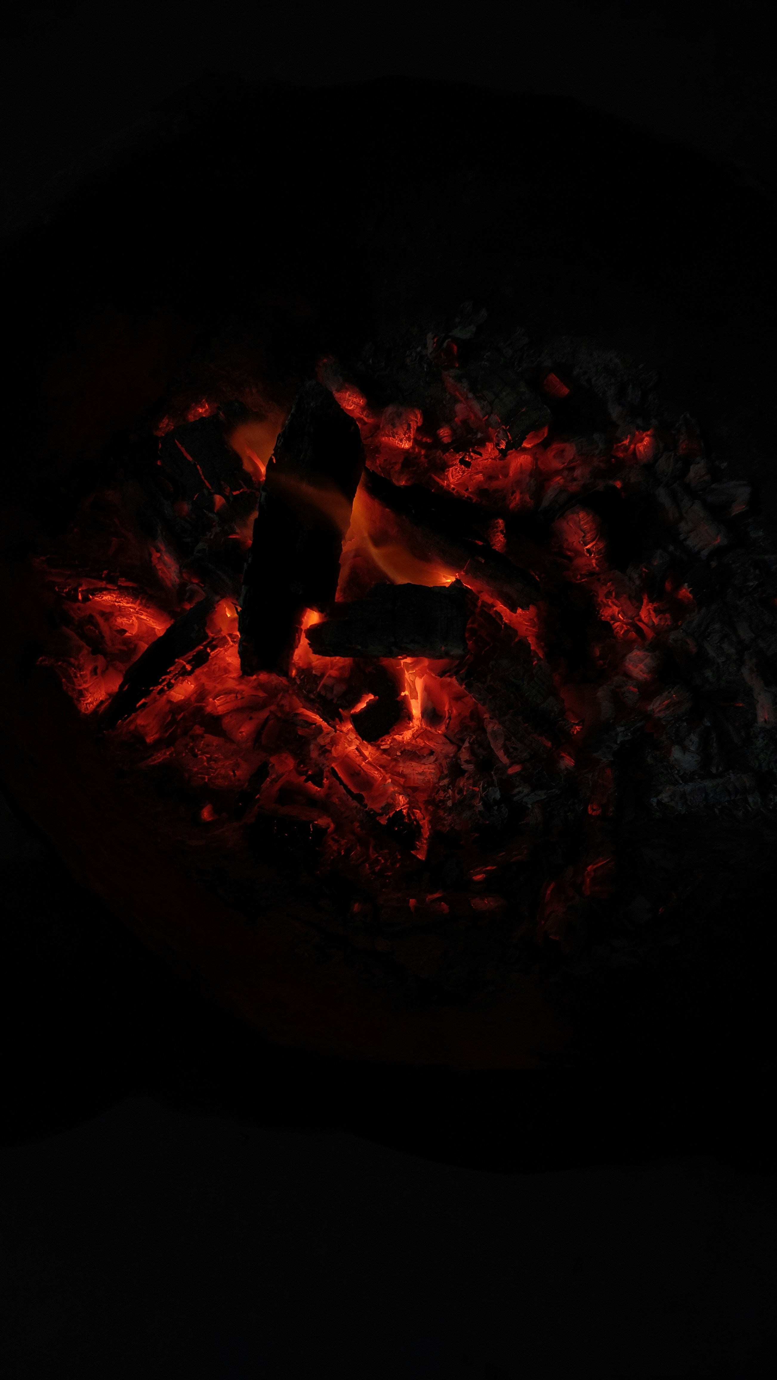 A person using a smartphone with a blurred city background