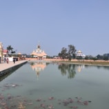 A peaceful temple courtyard with devotees in quiet reflection.