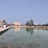 A serene temple setting with visitors engaged in prayer and reflection.