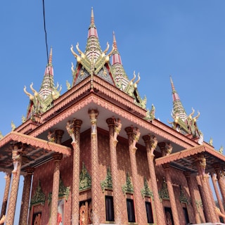 Sacred architecture of Tirupati Balaji temple adorned with colorful decorations and flowers.