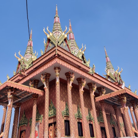 Sacred architecture of Tirupati Balaji temple adorned with colorful decorations and flowers.