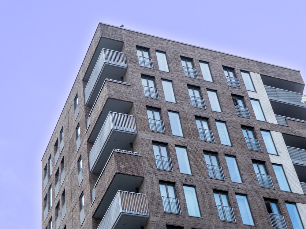 a tall brick building with balconies and balconies