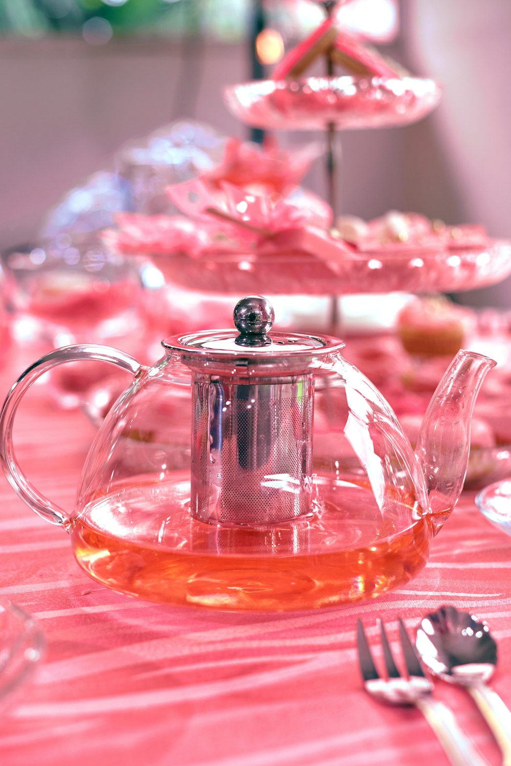 a tea pot with a tea kettle on a table