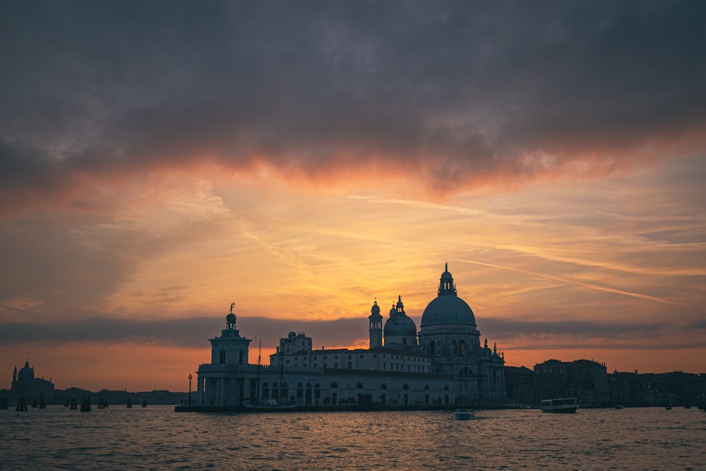 a large building sitting on top of a body of water